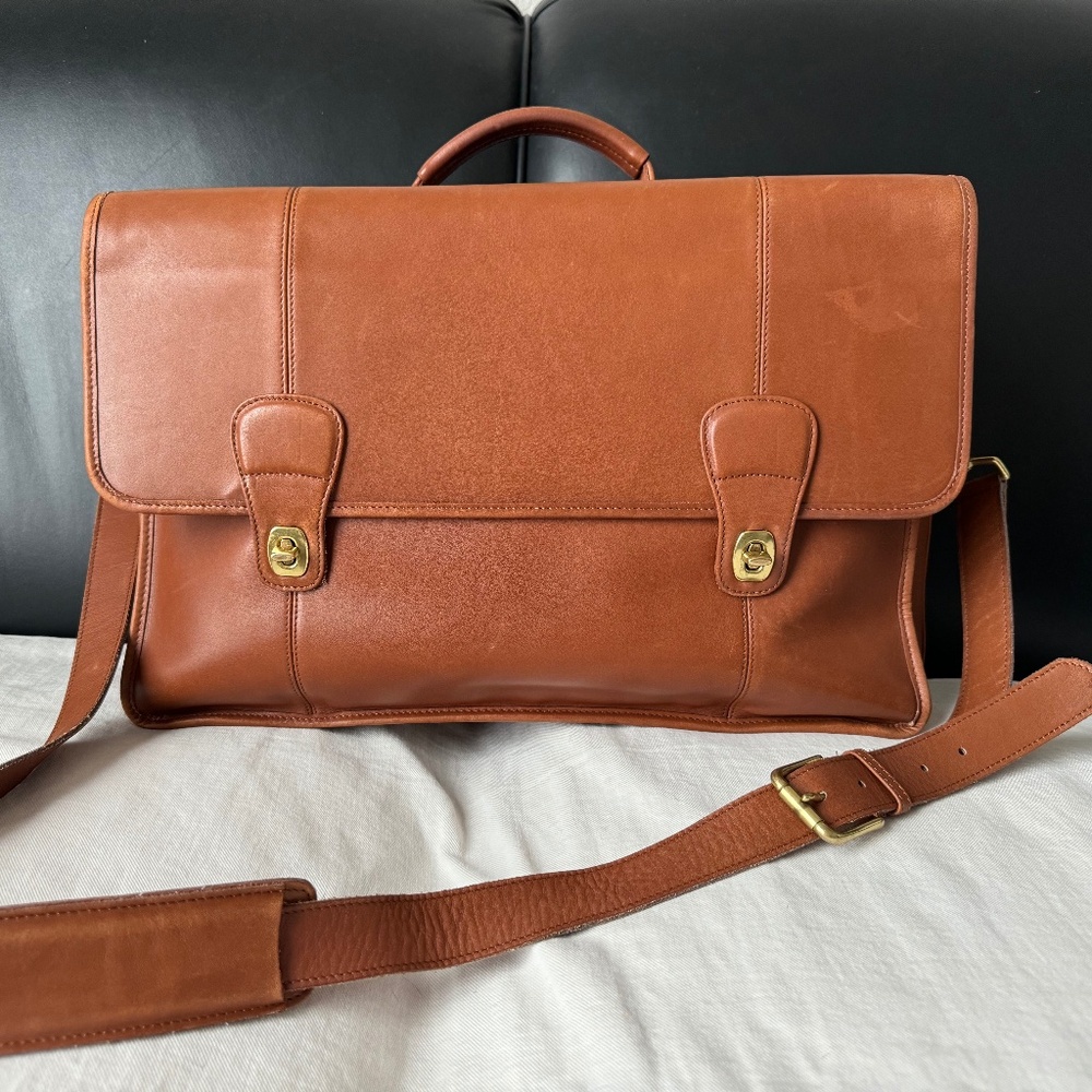 Very well-loved Coach leather briefcase with adjustable strap